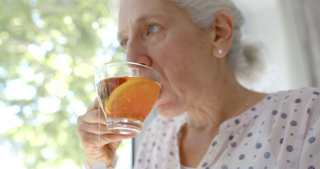 Elderly Woman Drinking Tea With Lemon - Download Free Stock Images Pikwizard.com
