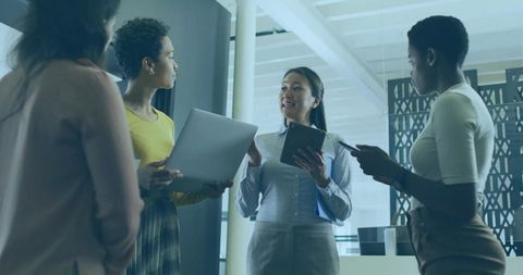 Team of Diverse Women Collaborating in Modern Office Environment