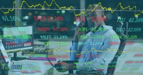 African American Businessman Analyzing Stock Market Data in Office