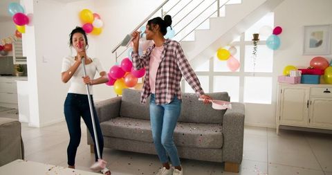 Mother and Daughter Cleaning Up After Party