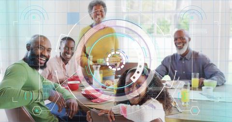 Multigenerational african american family sharing breakfast with digital tech overlay
