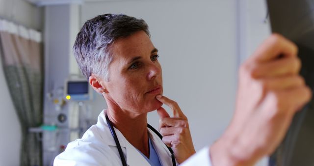 Female Doctor Examining X-Ray in Hospital Room - Download Free Stock Images Pikwizard.com