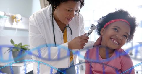 Doctor Examining Young Girl with DNA Strands Overlay
