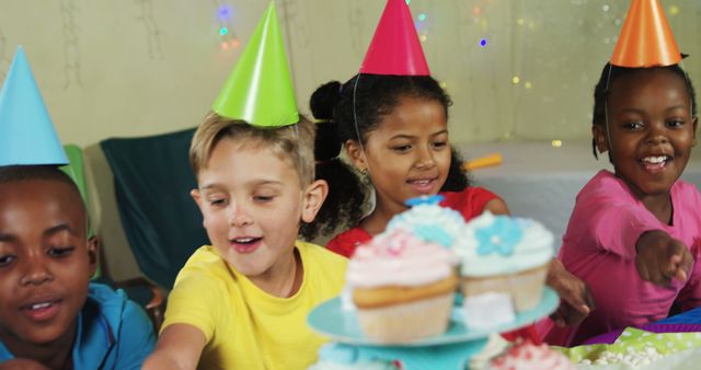 Excited Children Enjoying Cupcakes at Fun Birthday Party - Download Free Stock Images Pikwizard.com