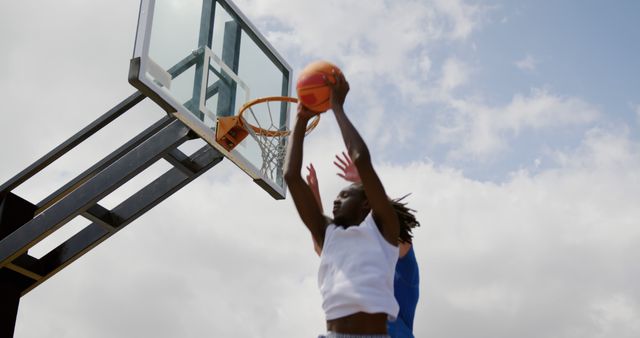 Basketball Player Dunking Ball during Outdoor Game - Download Free Stock Images Pikwizard.com