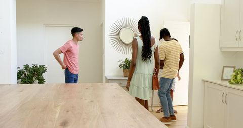 Friends Socializing and Chatting in Modern Living Space