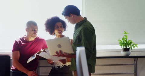 Diverse Young Professionals Conduct Team Meeting with Laptop - Download Free Stock Images Pikwizard.com