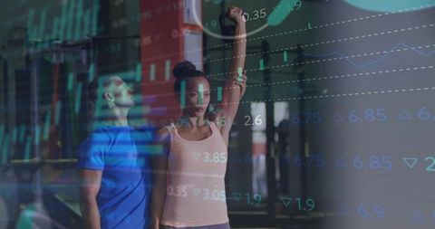 Lifting kettlebell with trainer spotting and financial chart overlay for fitness concept