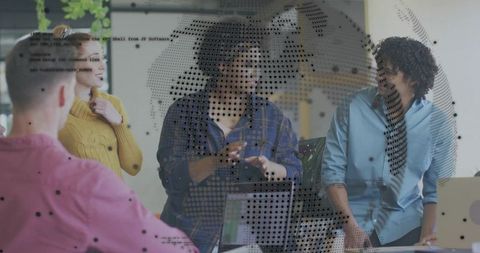 Team brainstorming and collaborating with global data overlay in open office workspace