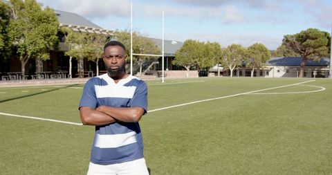 Confident Athlete Standing on Rugby Field Ready for Action