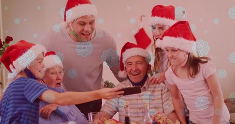 Festive Family in Santa Hats Using Smartphone During Christmas Celebration