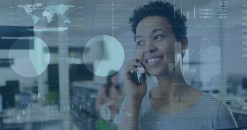 Smiling Woman Discussing Business Strategies Over Phone in Modern Office