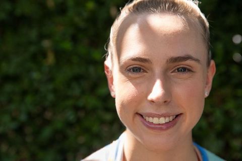 Smiling Woman Outdoors Embracing Serenity and Wellness