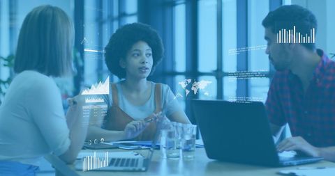 Multiracial Team Discussing Financial Data in Modern Office