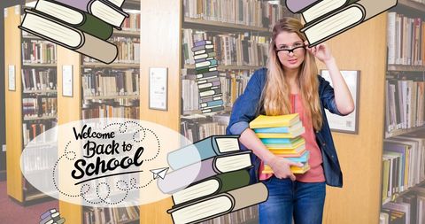 Caucasian Student in Library Holding Stack of Books