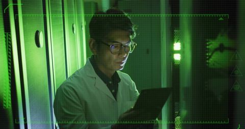 Asian Engineer in Server Room with Digital Interface - Download Free Stock Images Pikwizard.com