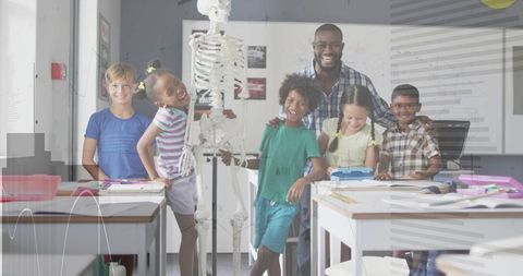 Elementary Students Examining Skeleton Model with Smiling Teacher in Bright Science Lab