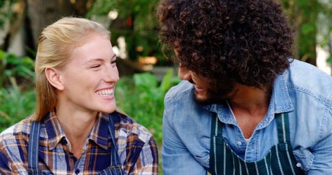 Smiling Team Working Together on Plant Care