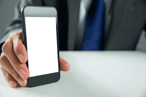 Businessman Displaying Smartphone with Transparent Copy Space - Download Free Stock Videos Pikwizard.com