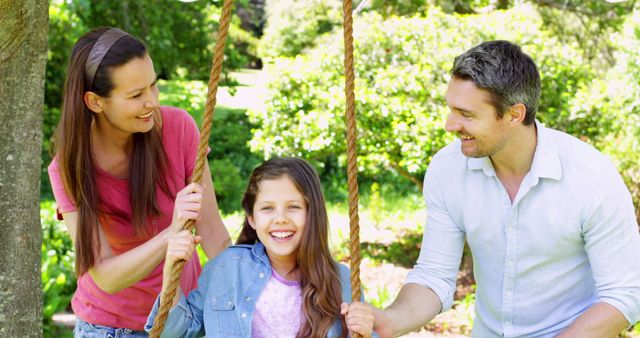 Happy Family Enjoying Outdoor Activities Together on Rope Swing - Download Free Stock Images Pikwizard.com