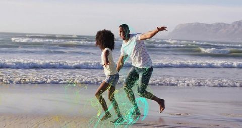Father and Daughter Playfully Running on Scenic Beach Shore