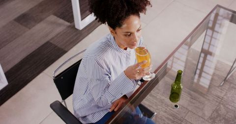 Woman Enjoying Refreshing Beverage During Office Break
