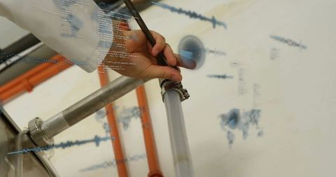 Technician in Modern Laboratory Engaging in Advanced Monitoring Techniques