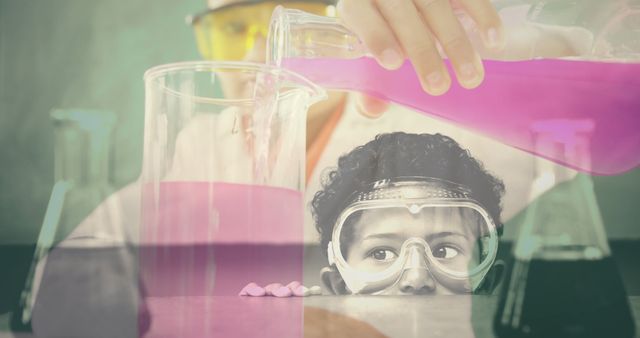 A curious boy wearing safety goggles is closely observing a science experiment in a laboratory. The child is captivated by the mixing and pouring of purple solutions into beakers by an adult. Great for educational content, school science programs, STEM education promotions, or children's learning materials.