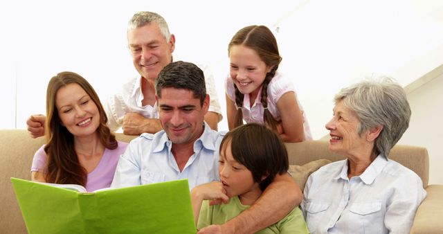 Family Reading Together on Couch, Enjoying Quality Time - Download Free Stock Images Pikwizard.com