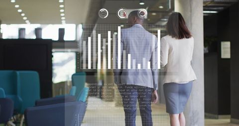 Coworkers Analyzing Statistics in Modern Office Environment