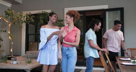 Friends Celebrating Engagement at Outdoor Party