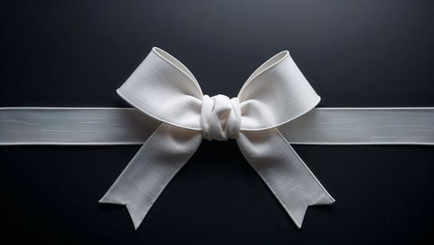 White Satin Ribbon Bow on Elegant Dark Background