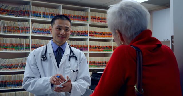 Doctor Consulting with Senior Patient at Modern Clinic - Download Free Stock Images Pikwizard.com