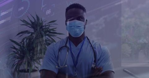 Confident Doctor in Scrubs With Mask in Healthcare Setting