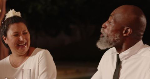 Interracial Friends Laughing Together at Outdoor Celebration