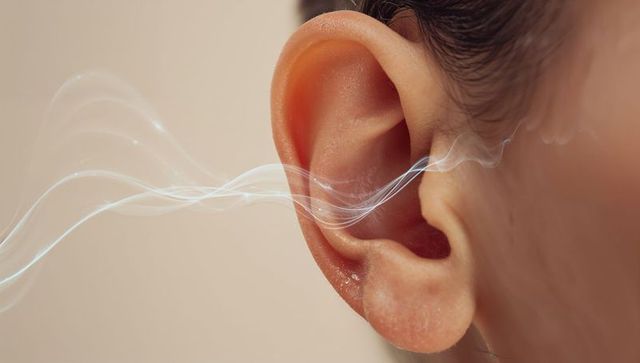 Right ear receiving soft sound waves closeup, hearing concept and audiology visual
