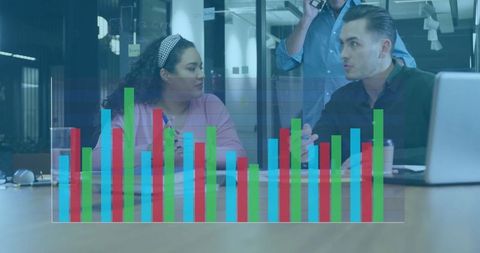 Business Team Analyzing Graphs in Modern Office Setting