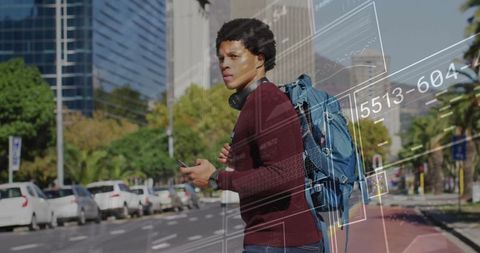 Tech-Savvy Man Using Smartphone in Vibrant Urban Setting