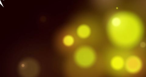 Festive snowflakes and brushed lights on dark background