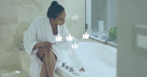 Woman in White Bathrobe Adjusting Tub Faucet Creating Relaxing Atmosphere