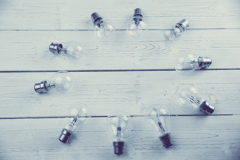 transparent light bulbs arranged in circular pattern on wood - Download Free Stock Videos Pikwizard.com