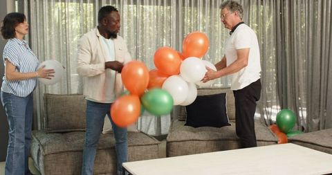 Joyful team collaborating to clean up post office party