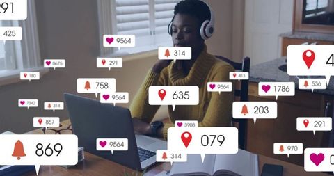 Remote worker wearing headset typing on laptop at home surrounded by social media notification icons