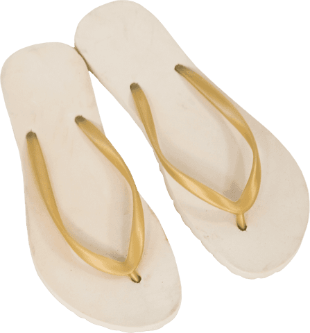 White flip-flops with gold straps on transparent background