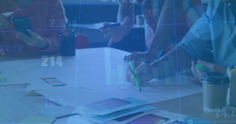 Team members collaborating on app mockups in modern meeting room