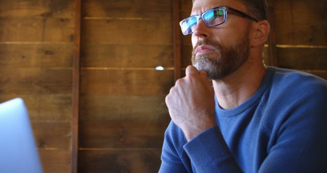 Caucasian Man in Glasses Working from Home Office in Wooden Interior - Download Free Stock Images Pikwizard.com