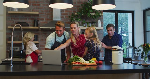 Family Cooking Together and Watching Recipe on Laptop in Modern Kitchen - Download Free Stock Images Pikwizard.com