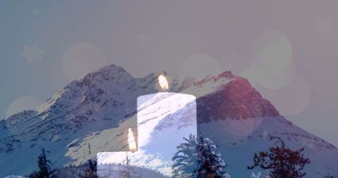 Serene Candle Glow Against Winter Mountain Landscape - Download Free Stock Images Pikwizard.com