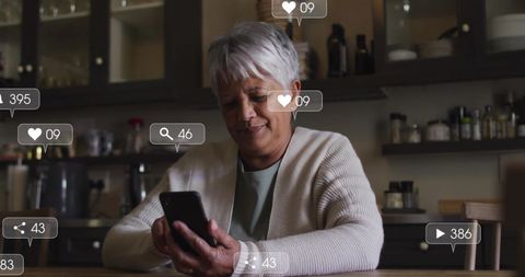 Senior Woman Enjoying Social Media on Smartphone at Home