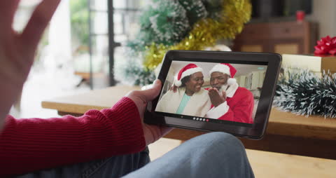 Man Enjoying Video Call with Family During Holidays